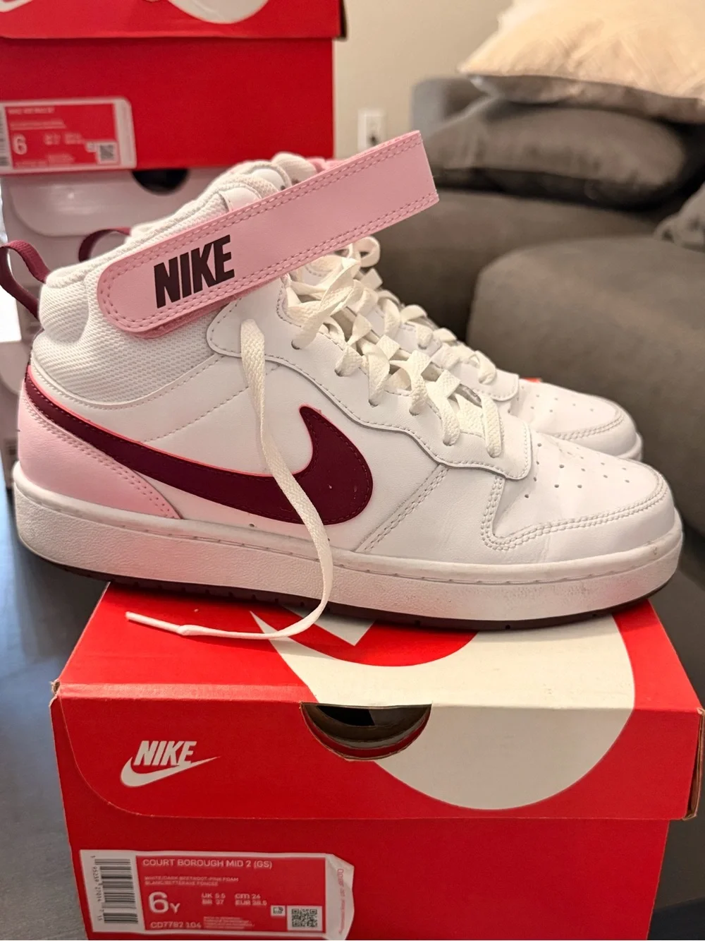 Nike White High-Top Sneakers with Pink Strap and Maroon Swoosh